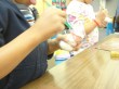 Kinders painting their ceramic snowman. Notice the tongue in the upper right hand corner? Now that's concentration!
