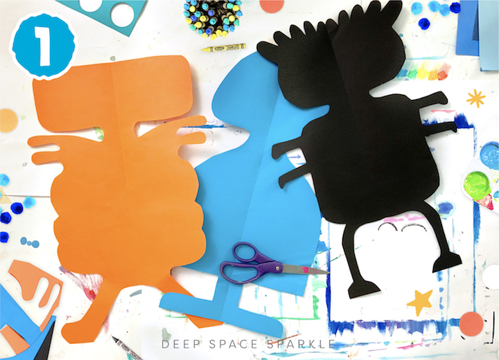 Symmetrical Paper Cut Aliens art project for kids