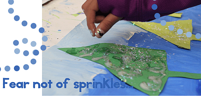 Inspired by the book, Once Upon a Northern Night, kids paint a snowy background and use the rules of color perspective to make a forest of glittery trees. 