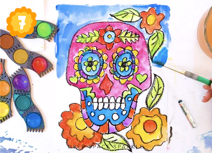 How to paint your skull using watercolors in the project on How to Draw and Paint a Sugar Skull art project for celebrating Day of the Dead, Dia de los Muertos in the art room or at home with kids