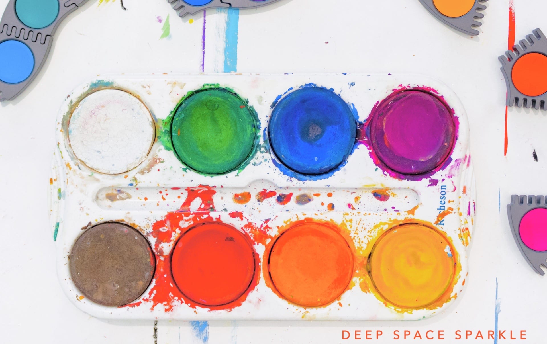 using pan watercolors to prepare for teaching art on a cart